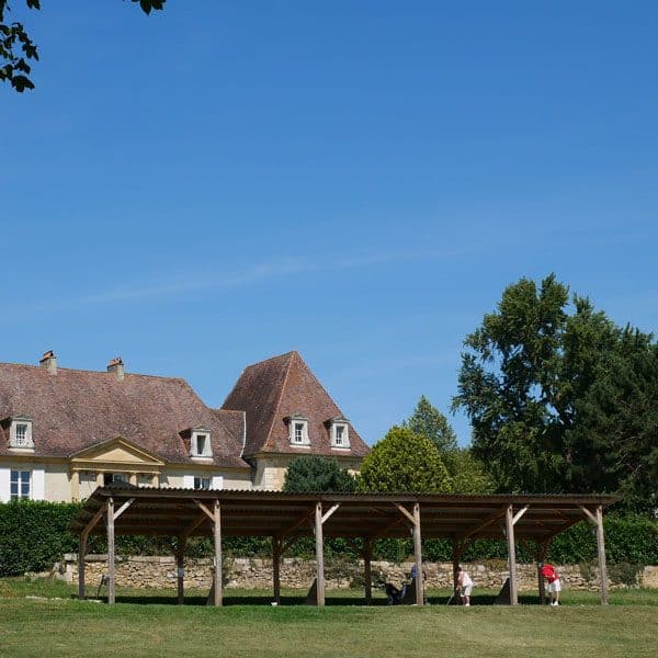 view of hotel les merles from the driving range